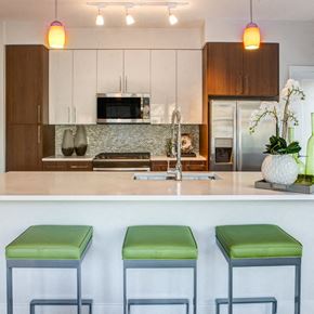 Dobbs Ferry apartment for rent - a kitchen with three stools in front of a counter