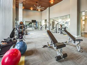 Dobbs Ferry apartment for rent - a gym with weights and other exercise equipment in a building
