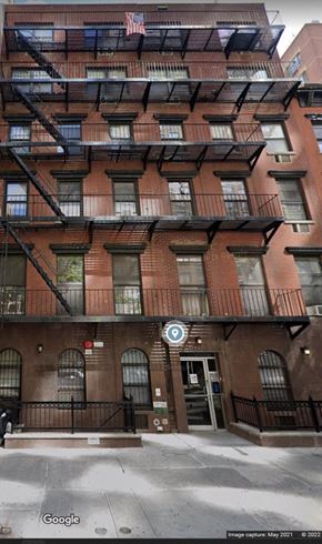 New York apartment for rent - the apartment building has several balconies and a fire escape