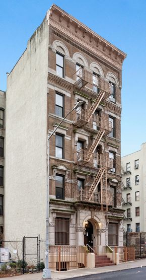 New York apartment for rent - the facade of an apartment building with fire escapes