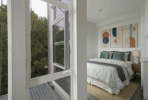 Seattle apartment for rent - A bedroom with a bed and a painting on the wall.