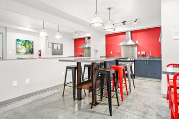 Seattle apartment for rent - a dining area with a bar and chairs and a kitchen