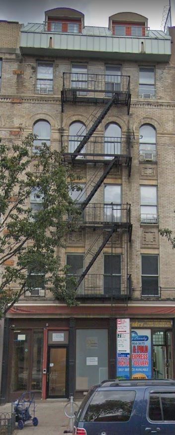 New York apartment for rent - a building with a fire escape on the side of it