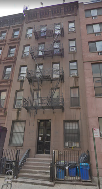 New York apartment for rent - the front of a building with stairs and a door