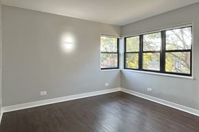 Oak Park apartment for rent - A room with a window and a wooden floor.