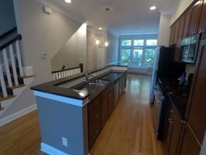 Atlanta house for rent - an empty kitchen with a large island in the middle