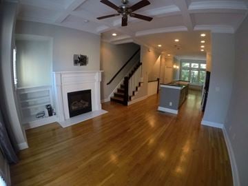 Atlanta house for rent - a living room with a fireplace and a hard wood floor