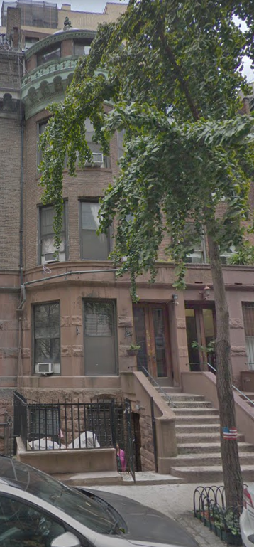 New York apartment for rent - a building with stairs and a tree in front of it