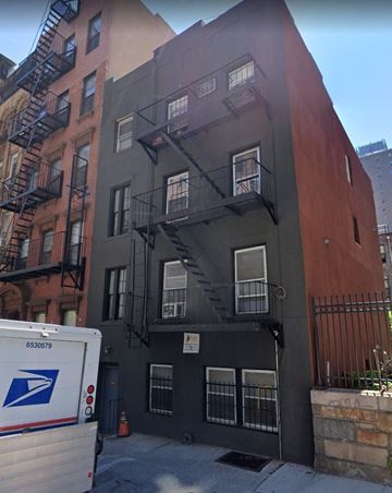 New York apartment for rent - a building with a fire escape on the side of it
