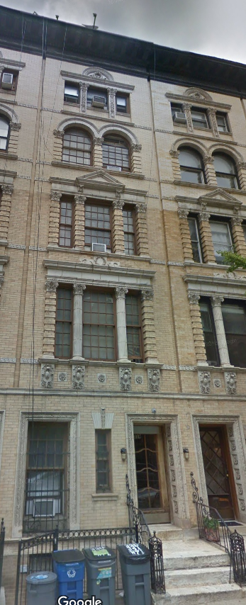 New York apartment for rent - the facade of a building with stairs and windows
