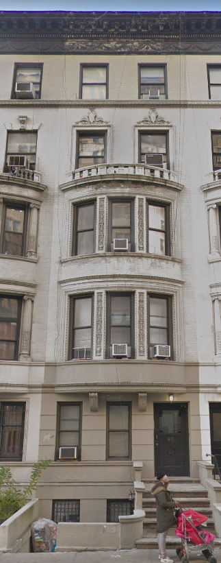 New York apartment for rent - a person is standing on the steps of a building