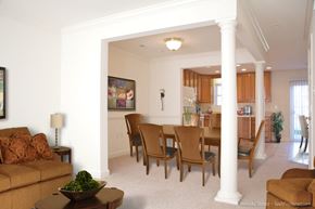 Hagerstown apartment for rent - A living room with a brown couch and a painting on the wall.