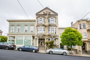 San Francisco apartment for rent - A row of houses with cars parked in front.
