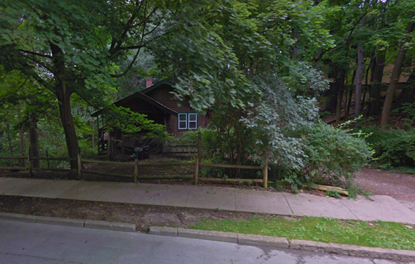 Ithaca apartment for rent - a house in the woods behind a wooden fence