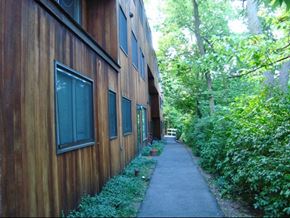 Ithaca apartment for rent - a sidewalk in front of a wooden building