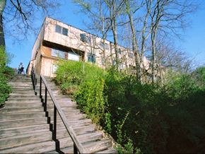Ithaca apartment for rent - a house with a staircase and a person walking up the stairs