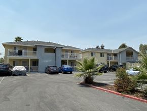 San Jose apartment for rent - a parking lot at the whispering winds apartments in pearland, tx