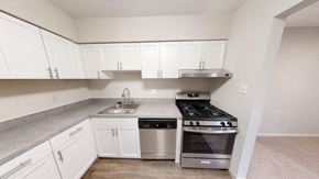 Martinsburg apartment for rent - an empty kitchen with a stove and a sink