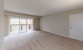 Martinsburg apartment for rent - an empty living room with a door to a balcony