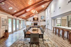 Westlake apartment for rent - a large dining room with a table and chairs and a fireplace