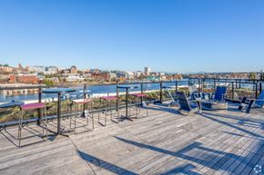 Seattle apartment for rent - the deck on the top of the building has tables and chairs