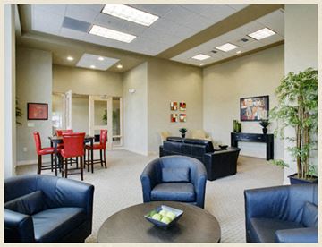 Seattle apartment for rent - a living room with couches and chairs and a dining room table