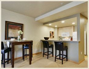 Seattle apartment for rent - a kitchen with a bar and a dining table