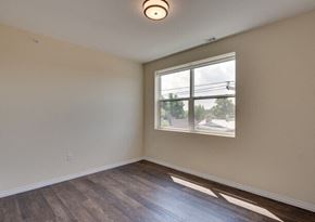 Whiting apartment for rent - the living room of an empty house with a window