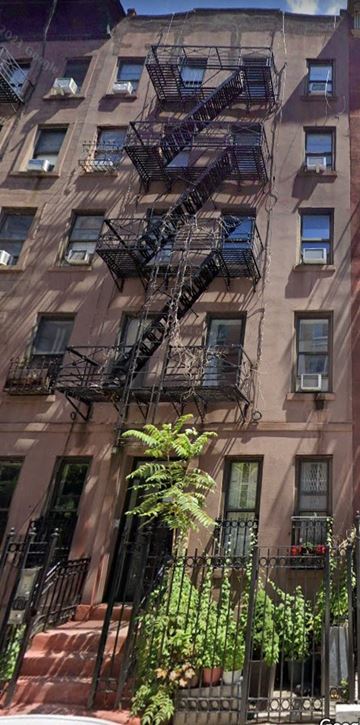 New York apartment for rent - a fire escape on the side of a building