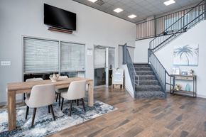Cincinnati apartment for rent - A modern dining room with a wooden table and chairs.
