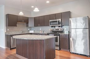 Cranberry Township apartment for rent - a kitchen with stainless steel appliances and granite counter tops