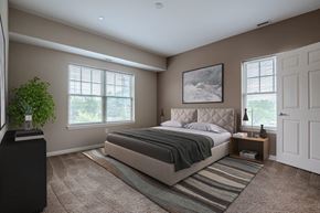 Cranberry Township apartment for rent - a bedroom with a bed and two windows