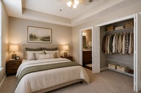 Huntsville apartment for rent - A bedroom with a large bed and a wardrobe.