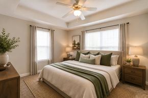 Memphis apartment for rent - A bedroom with a large bed and a ceiling fan.