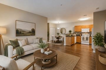 Memphis apartment for rent - A living room with a white couch, a coffee table, and a painting on the wall.