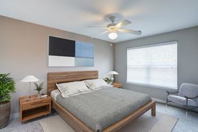 Memphis apartment for rent - a bedroom with a bed and a ceiling fan