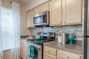 Pittsburgh apartment for rent - a kitchen with a stove and a microwave