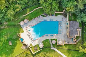 Pittsburgh apartment for rent - An aerial view of a backyard with a swimming pool and a deck.
