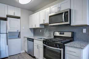 Harrisburg apartment for rent - a kitchen with stainless steel appliances and white cabinets