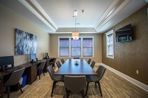 Baldwinsville apartment for rent - a conference room with a large table and chairs