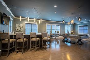 Baldwinsville apartment for rent - a game room with a pool table and a bar