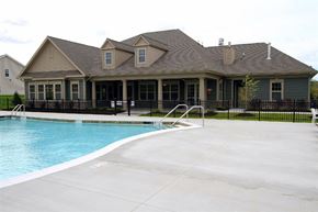 Watertown apartment for rent - A house with a pool in front.