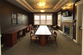 Watertown apartment for rent - A conference room with a long table and chairs.
