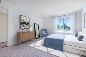 Camillus apartment for rent - a bedroom with a bed and a dresser and a window