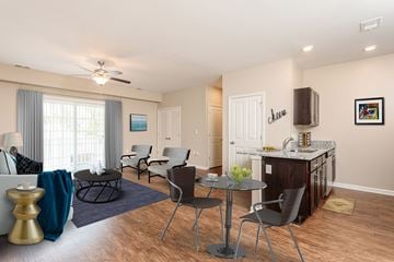 Camillus apartment for rent - a living room with a kitchen and a table