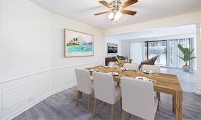 Orchard Park townhouse for rent - A dining room with a wooden table and chairs.