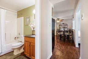 Hamburg apartment for rent - a bathroom with a toilet and a dining room table