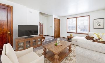 Buffalo townhouse for rent - a living room with a couch and a television
