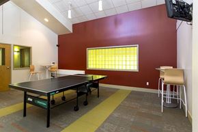 Tonawanda apartment for rent - a game room with a ping pong table and a tv