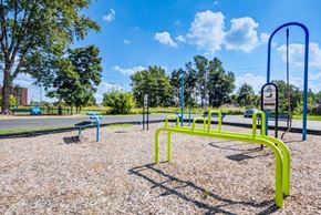 Brockport townhouse for rent - Outdoor fitness stations with signs instructing how to use each station